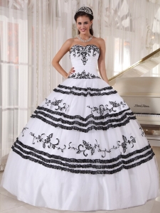 White Quinceanera Dress with Black Floral Embroidery and Hems