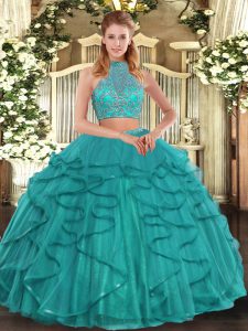 Sleeveless Tulle Floor Length Criss Cross 15th Birthday Dress in Turquoise with Beading and Ruffled Layers