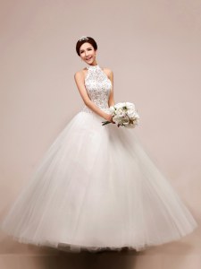 Inexpensive White Halter Top Neckline Beading and Appliques Wedding Gown Sleeveless Lace Up